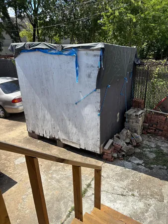 a view of a back yard from a balcony
