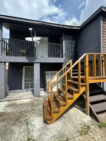 a view of balcony with furniture