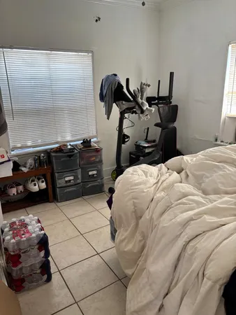 a bedroom with a bed and a closet