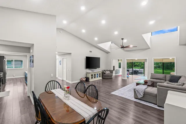 a bedroom with a bed and a ceiling fan