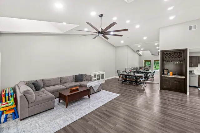 a bedroom with furniture and a wooden floor