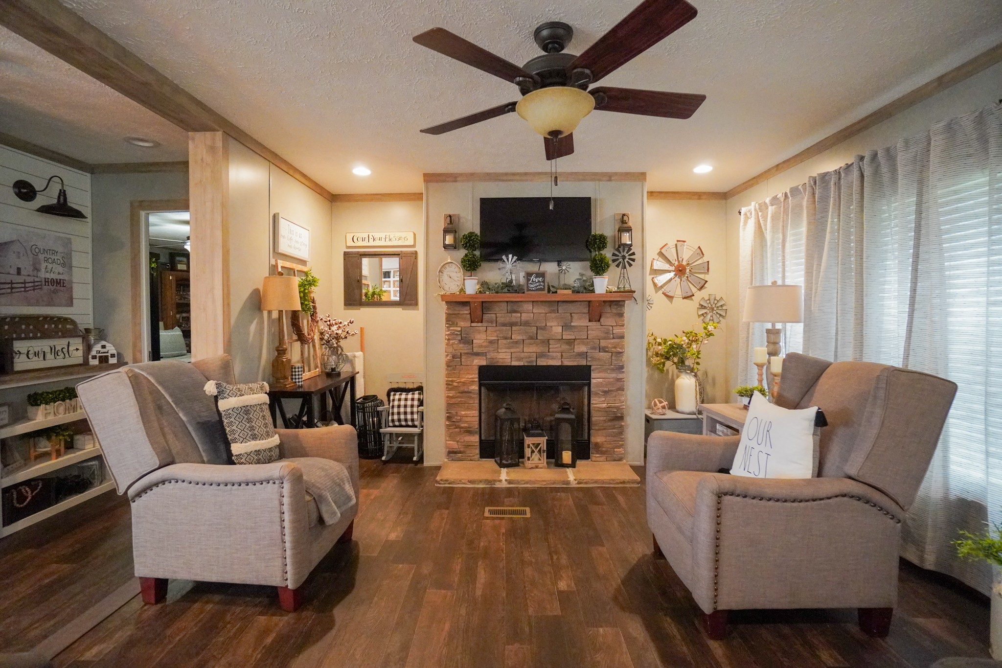 396 Gamaliel Road Red Boiling Springs, TN 37150 - Photo 16 of 45 a living room with furniture a flat screen tv and a fireplace