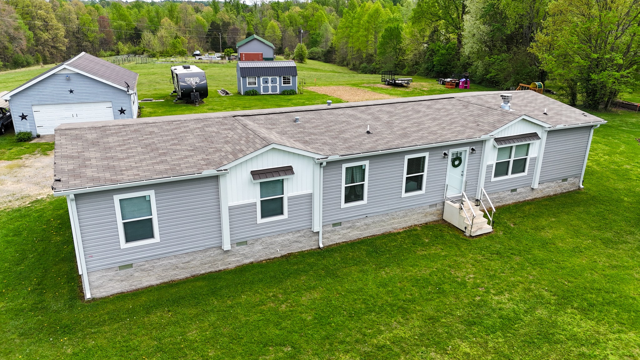 396 Gamaliel Road Red Boiling Springs, TN 37150 - Photo 2 of 45 a aerial view of a house with a yard and deck