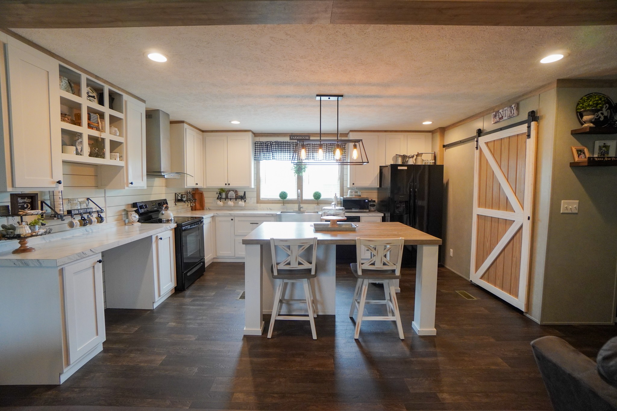 396 Gamaliel Road Red Boiling Springs, TN 37150 - Photo 8 of 45 a kitchen with a table chairs refrigerator and cabinets