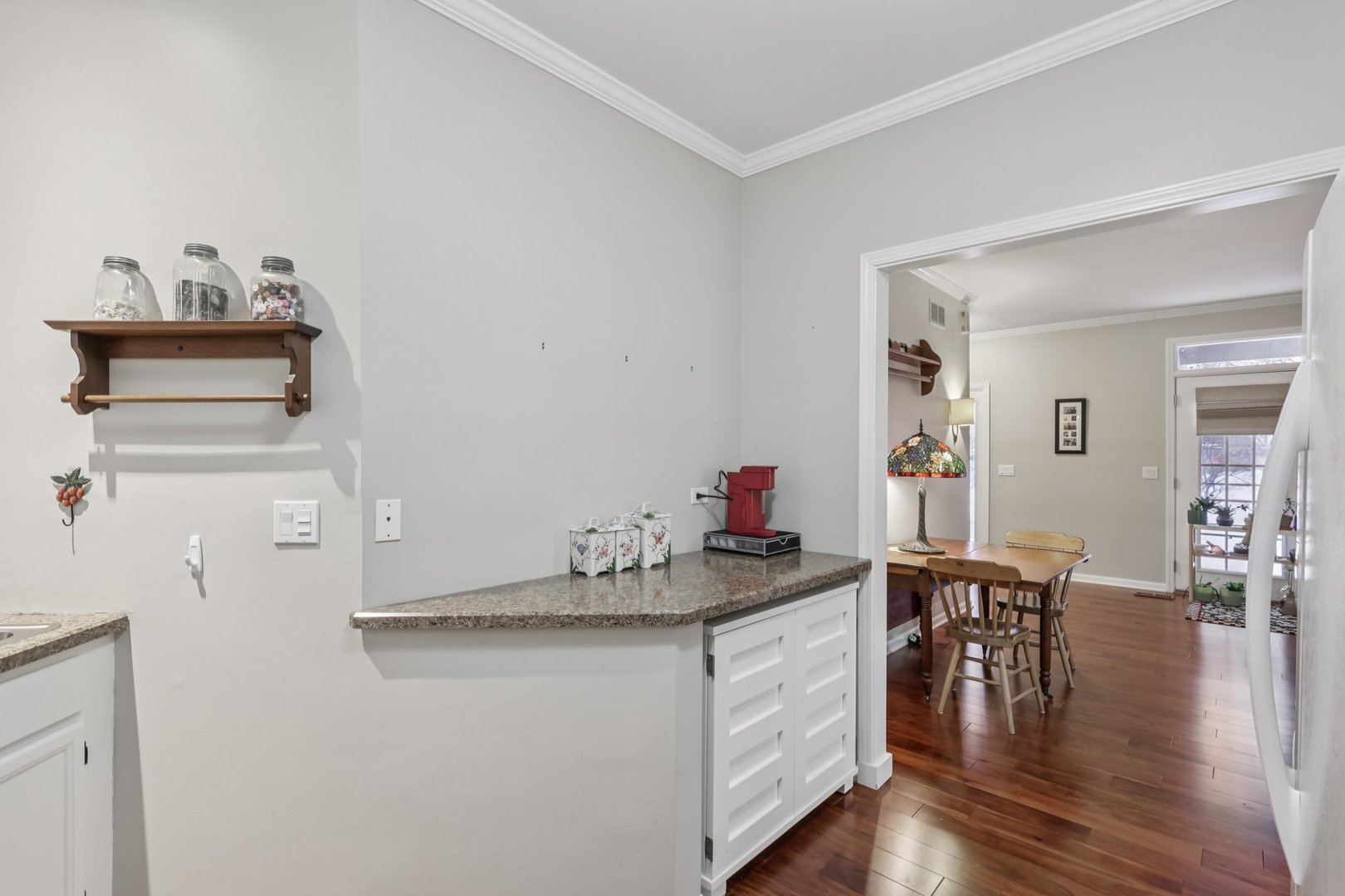 1262 Rhodes Lane Naperville, IL 60540 - Photo 6 of 23 a kitchen with granite countertop a white stove and cabinets