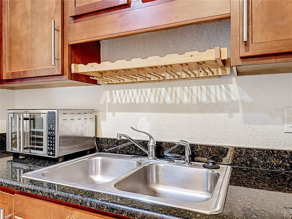1928 South Conway Road, Unit 33 Orlando, FL 32812 - Photo 12 of 34 a kitchen with a sink and cabinets