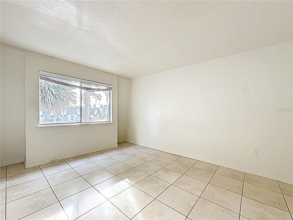 1928 South Conway Road, Unit 33 Orlando, FL 32812 - Photo 19 of 34 a view of an empty room with a window
