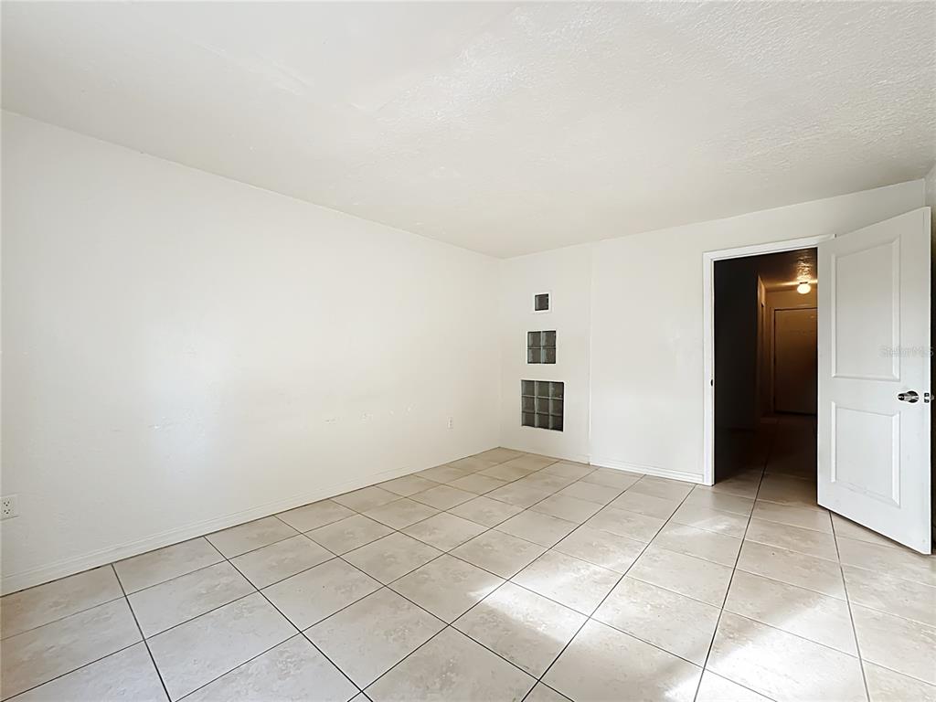 1928 South Conway Road, Unit 33 Orlando, FL 32812 - Photo 20 of 34 an empty room with kitchen