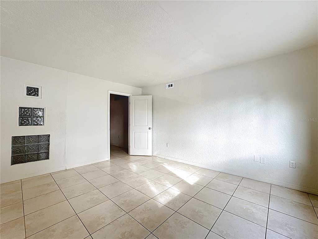 1928 South Conway Road, Unit 33 Orlando, FL 32812 - Photo 21 of 34 a view of an empty room with a window