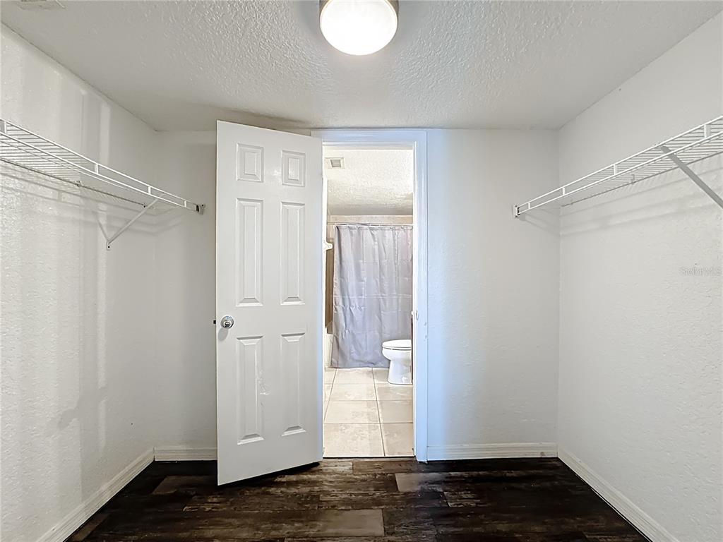 1928 South Conway Road, Unit 33 Orlando, FL 32812 - Photo 27 of 34 a view of empty room with wooden floor and fan