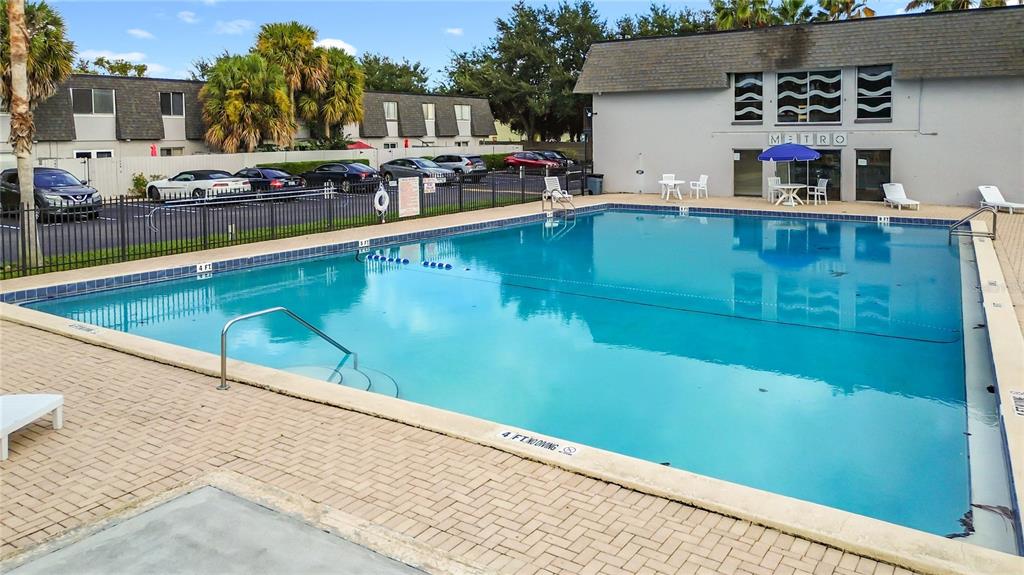 1928 South Conway Road, Unit 33 Orlando, FL 32812 - Photo 30 of 34 a view of swimming pool with outdoor seating