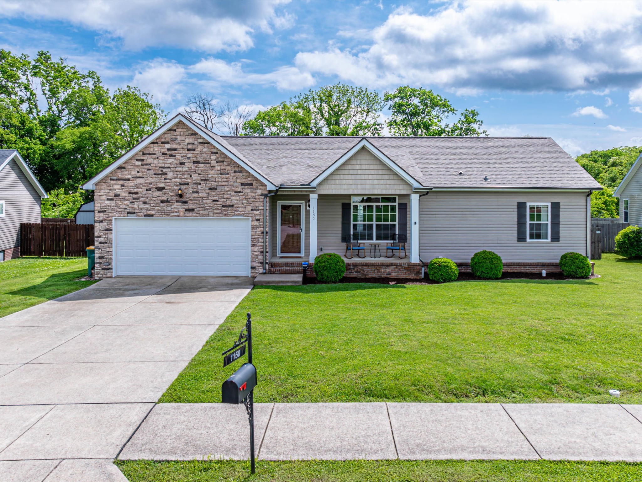 1150 Wrights Mill Road Spring Hill, TN 37174 - Photo 1 of 34 a front view of a house with a yard