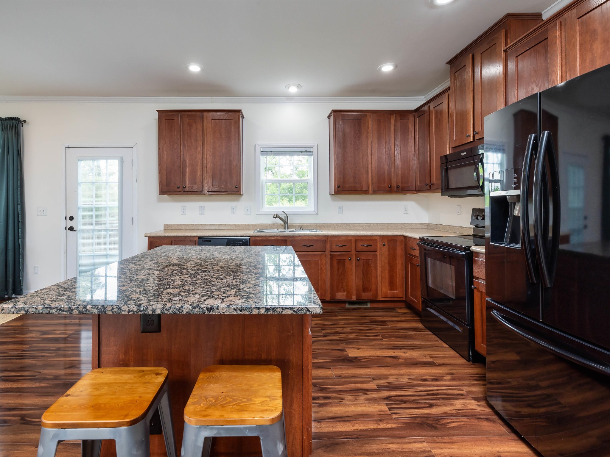 1150 Wrights Mill Road Spring Hill, TN 37174 - Photo 10 of 34 a kitchen with stainless steel appliances granite countertop wooden cabinets a oven and a refrigerator