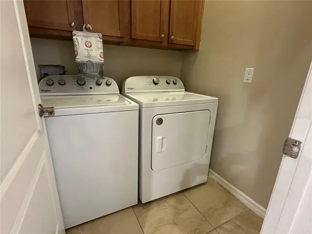 en empty room with window and wooden floor