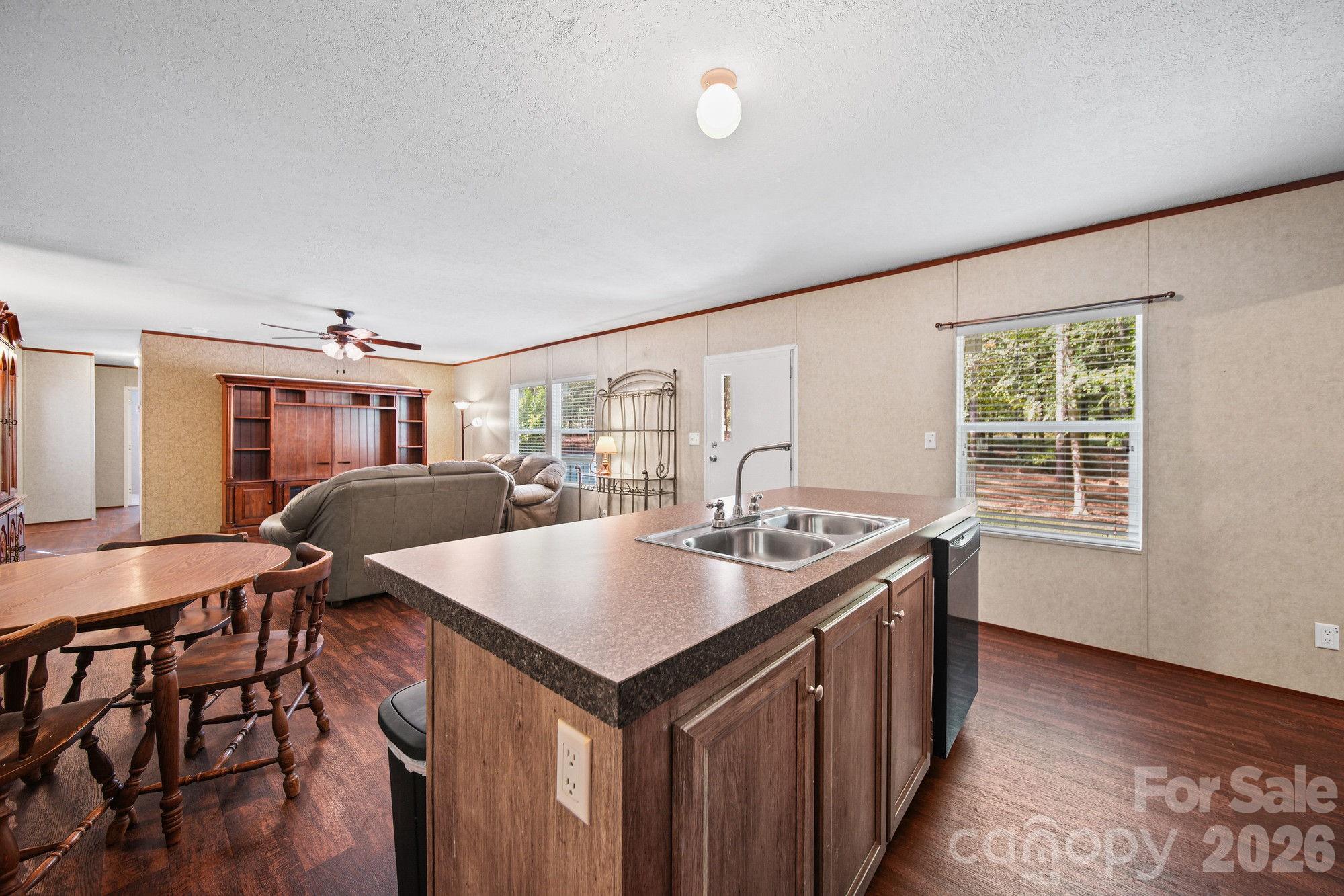 4507 White Store Road Wingate, NC 28174 - Photo 7 of 29 a living room with a table chairs and a table