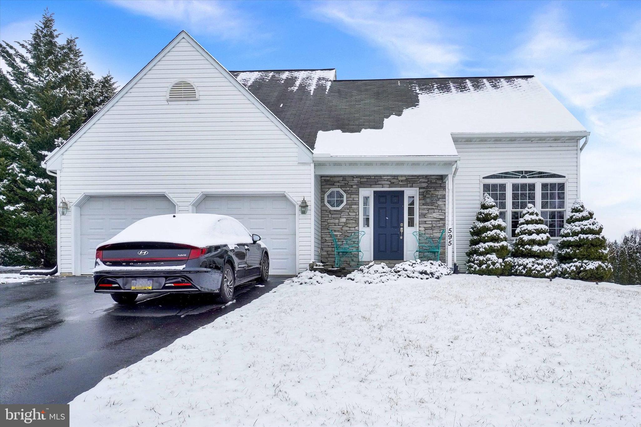 a car parked in front of white house
