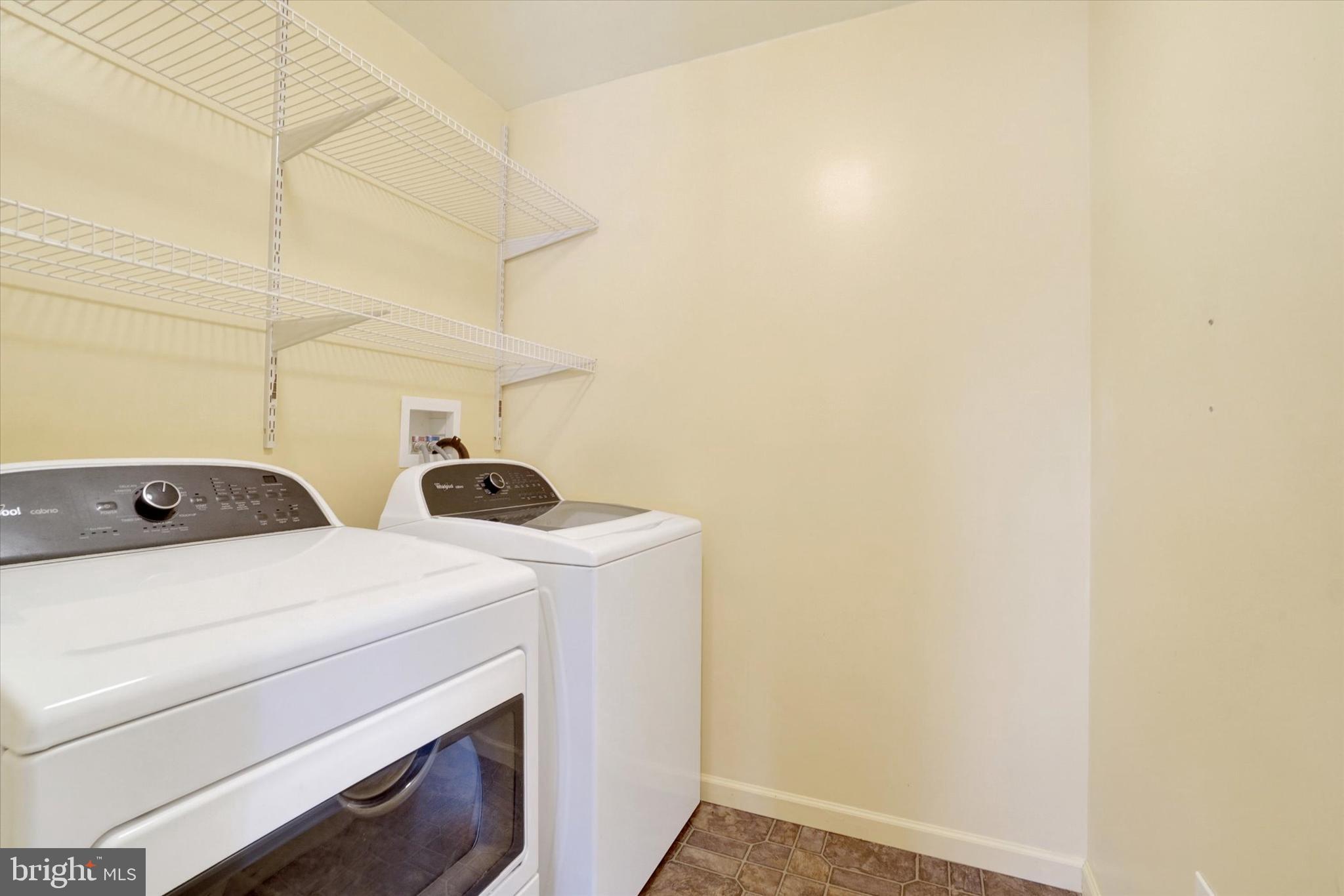 595 Apple Tree Lane Mount Wolf, PA 17347 - Photo 12 of 27 a utility room with dryer and washer