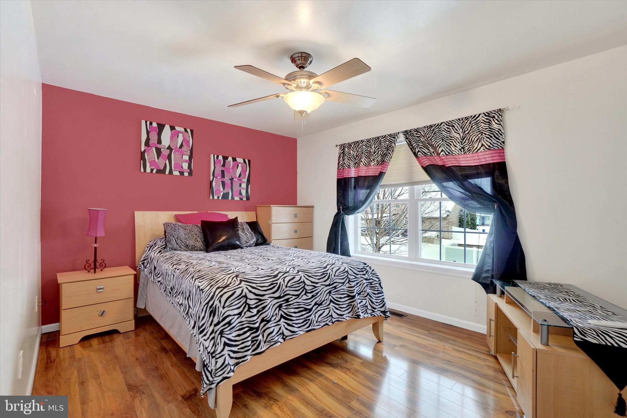 595 Apple Tree Lane Mount Wolf, PA 17347 - Photo 16 of 27 a bedroom with a bed and a window