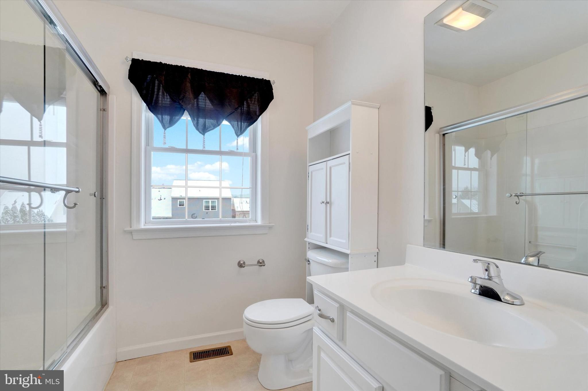 595 Apple Tree Lane Mount Wolf, PA 17347 - Photo 18 of 27 a bathroom with a sink toilet and mirror