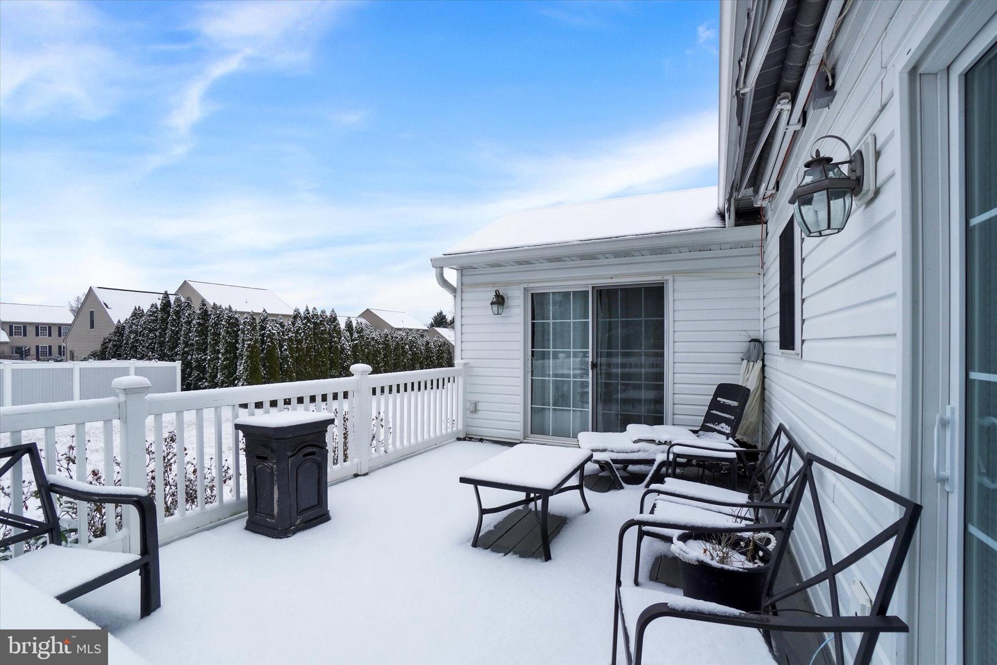 595 Apple Tree Lane Mount Wolf, PA 17347 - Photo 24 of 27 a view of a patio with a table and chairs