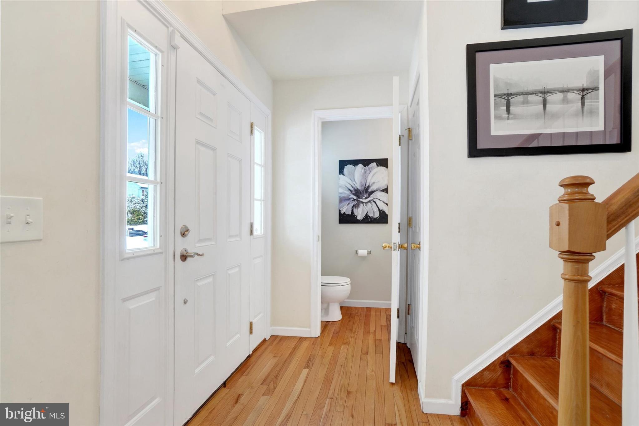 595 Apple Tree Lane Mount Wolf, PA 17347 - Photo 4 of 27 a view of a hallway with paintings on the wall