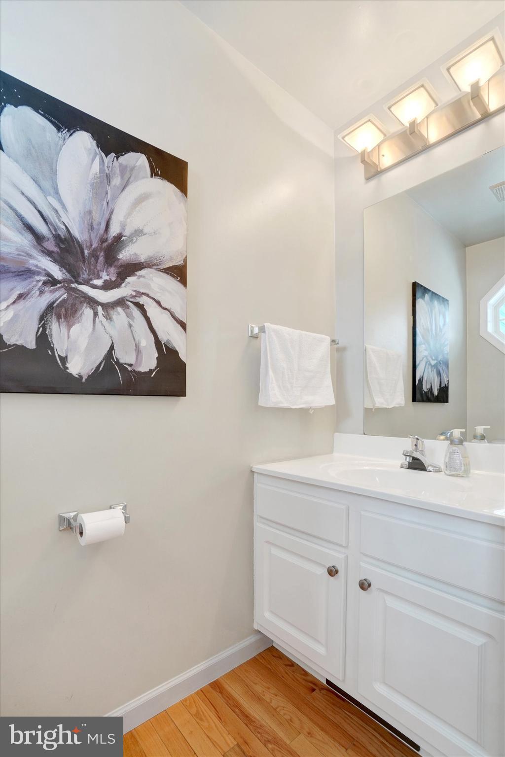 595 Apple Tree Lane Mount Wolf, PA 17347 - Photo 5 of 27 a bathroom with a sink and a mirror