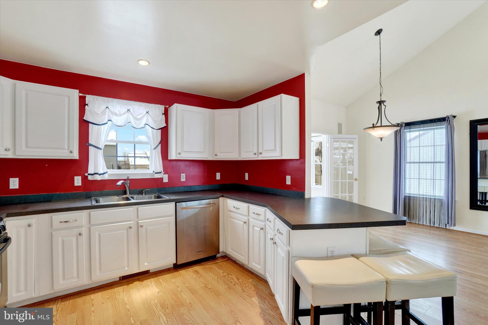 595 Apple Tree Lane Mount Wolf, PA 17347 - Photo 9 of 27 a kitchen with stainless steel appliances a sink counter space and a window