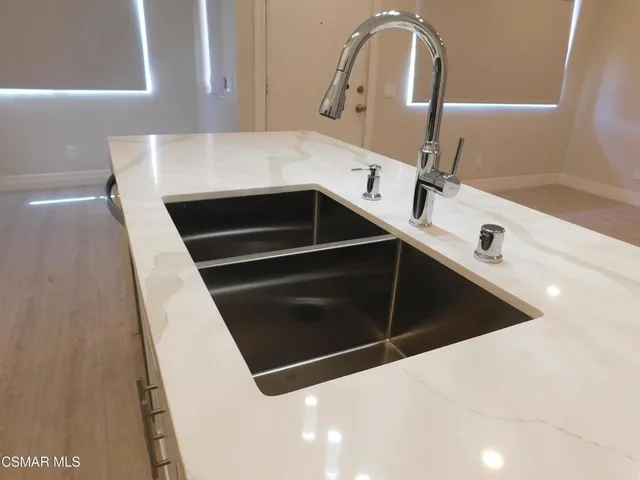 a close view of sink and washing machine