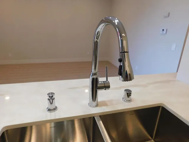 a stove top oven sitting inside of a kitchen