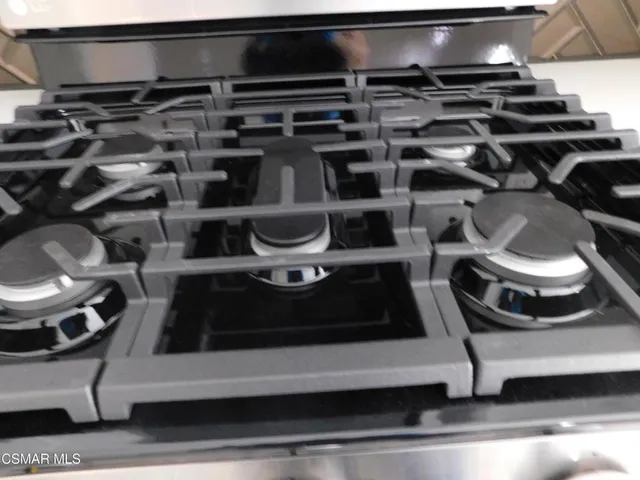 a kitchen with a stove and a microwave