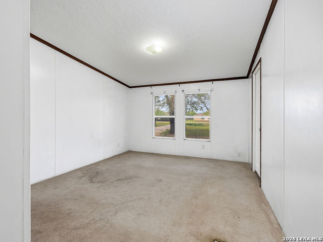 135 Savannah Ridge Von Ormy, TX 78073 - Photo 16 of 45 an empty room with windows