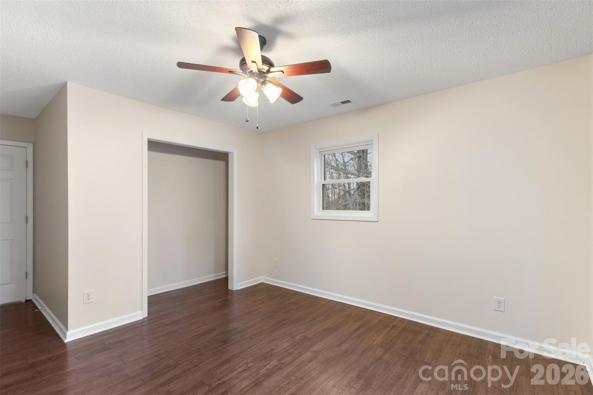 1751 Robert Martin Road Catawba, NC 28609 - Photo 11 of 29 an empty room with wooden floor fan and windows
