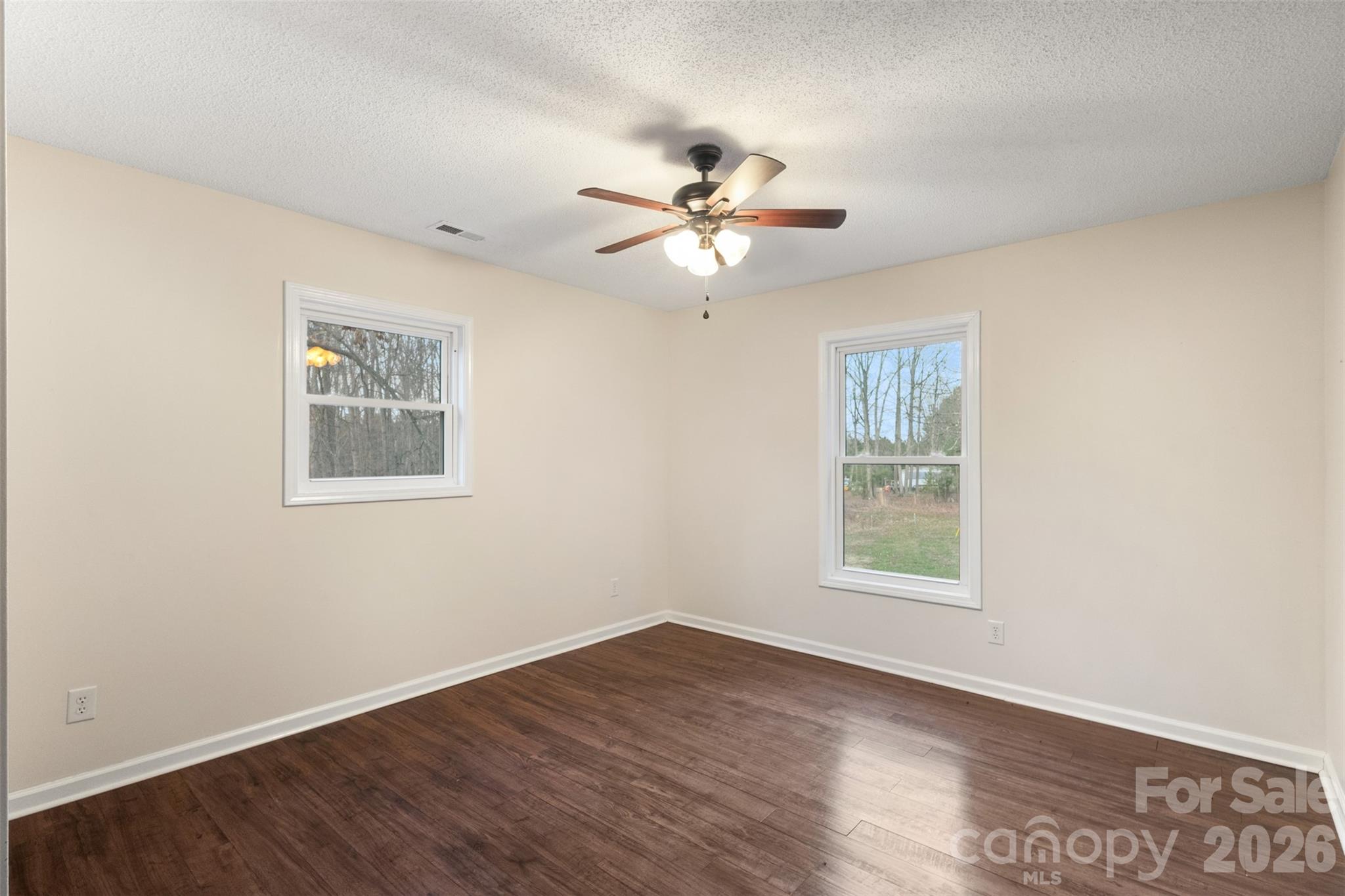 1751 Robert Martin Road Catawba, NC 28609 - Photo 12 of 29 a view of an empty room with a window and wooden floor