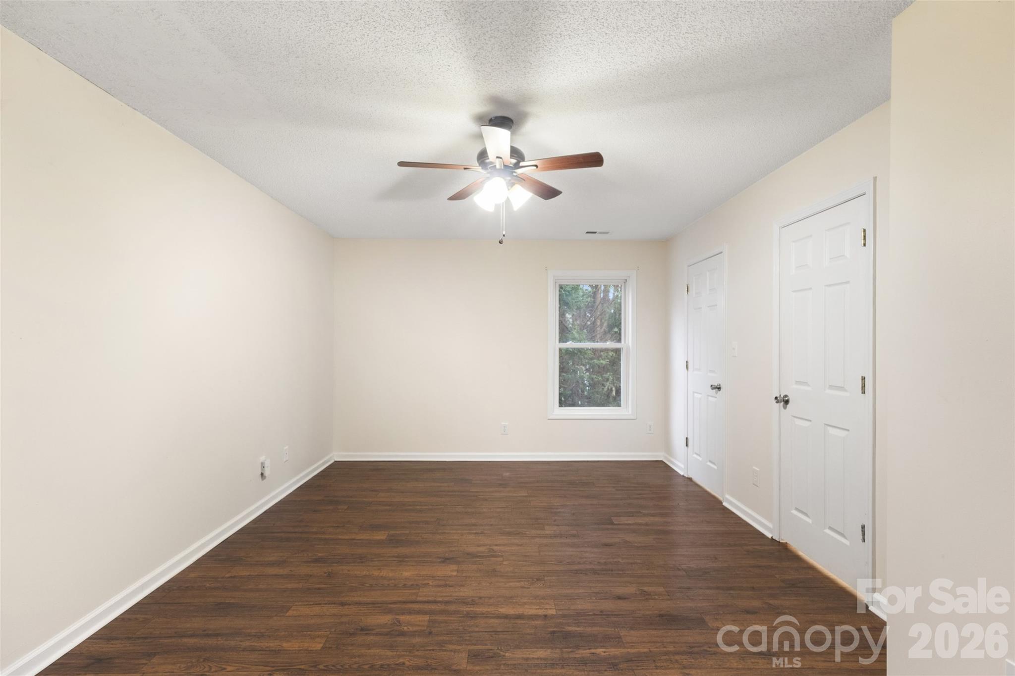 1751 Robert Martin Road Catawba, NC 28609 - Photo 14 of 29 a view of a room with wooden floor and a ceiling fan