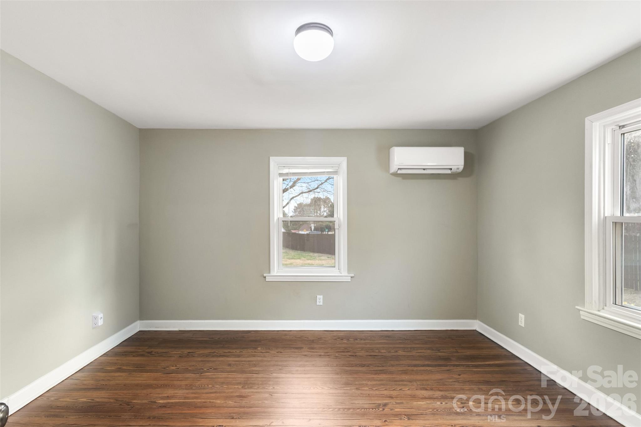 1751 Robert Martin Road Catawba, NC 28609 - Photo 18 of 29 an empty room with wooden floor and windows