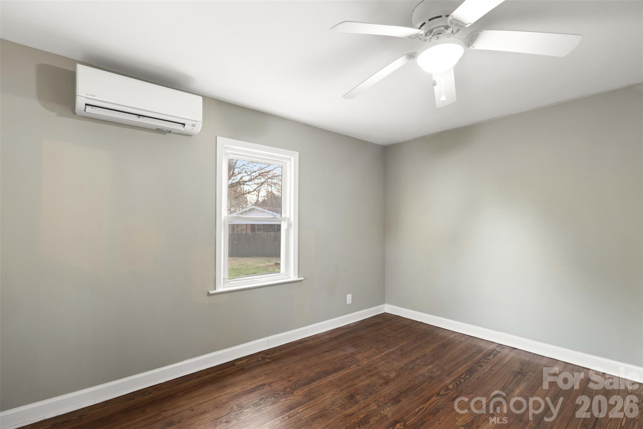 1751 Robert Martin Road Catawba, NC 28609 - Photo 20 of 29 an empty room with wooden floor and windows