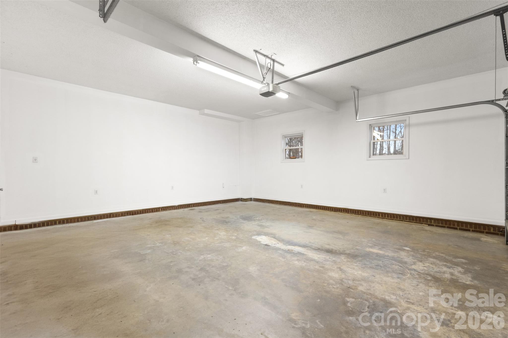 1751 Robert Martin Road Catawba, NC 28609 - Photo 9 of 29 an empty room with a ceiling fan and wooden floor