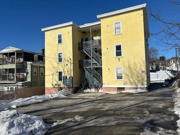 a view of a house with a door and a window