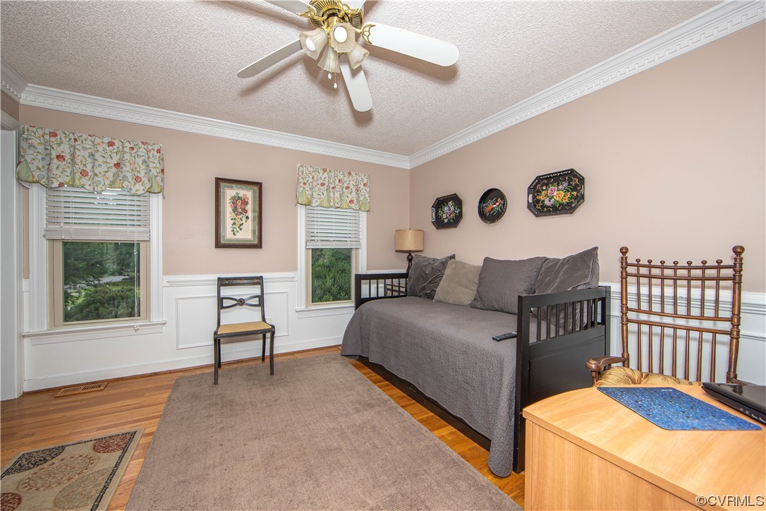 14908 Walnut Bend Road Midlothian, VA 23112 - Photo 11 of 43 a spacious bedroom with a bed and a table in it