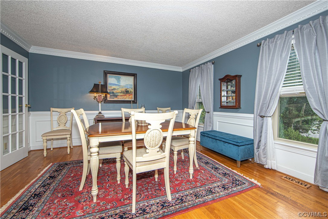 14908 Walnut Bend Road Midlothian, VA 23112 - Photo 12 of 43 a view of a dining room with furniture window and wooden floor