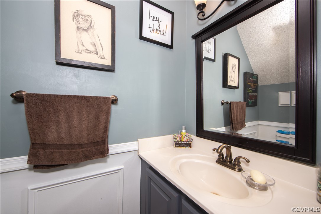 14908 Walnut Bend Road Midlothian, VA 23112 - Photo 15 of 43 a bathroom with a sink and a mirror