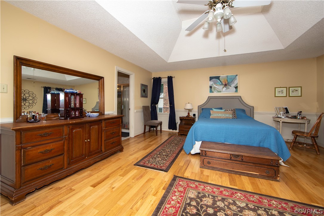 14908 Walnut Bend Road Midlothian, VA 23112 - Photo 20 of 43 a bedroom with a bed and a chandelier