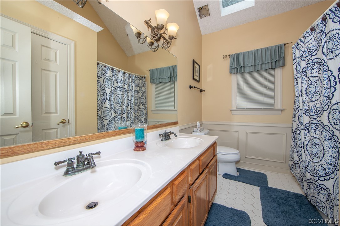 14908 Walnut Bend Road Midlothian, VA 23112 - Photo 22 of 43 a bathroom with a sink double vanity and a mirror