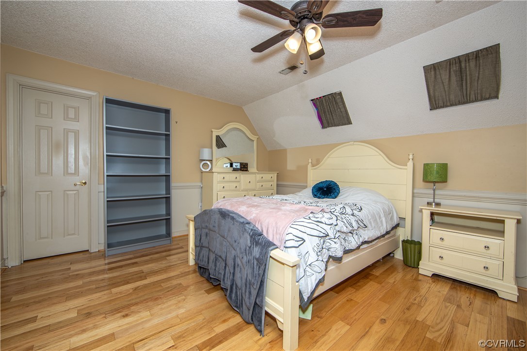 14908 Walnut Bend Road Midlothian, VA 23112 - Photo 27 of 43 a bedroom with a bed and a cabinets