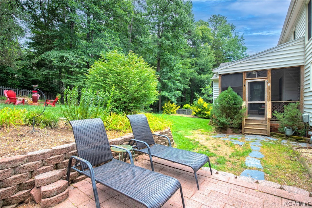 14908 Walnut Bend Road Midlothian, VA 23112 - Photo 28 of 43 a view of a chair and table in backyard of the house