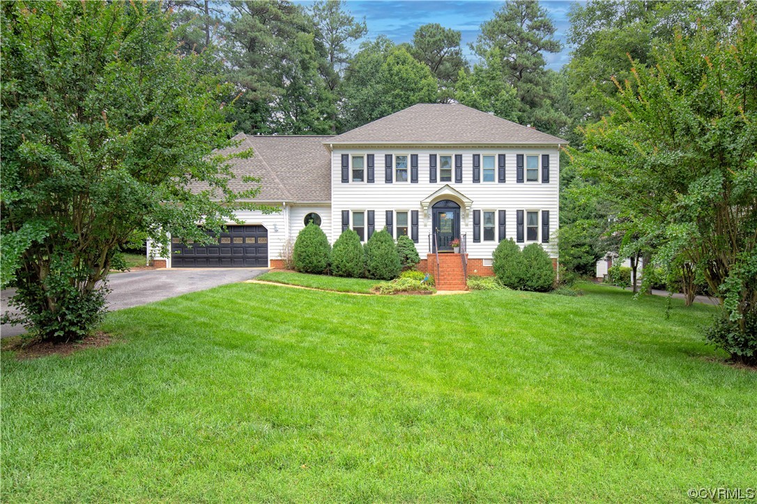 14908 Walnut Bend Road Midlothian, VA 23112 - Photo 43 of 43 a front view of a house with a garden