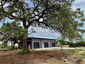 15430 Stroup Circle, Unit 2 Austin, TX 78734 - Photo 10 of 10 a front view of a house with a tree