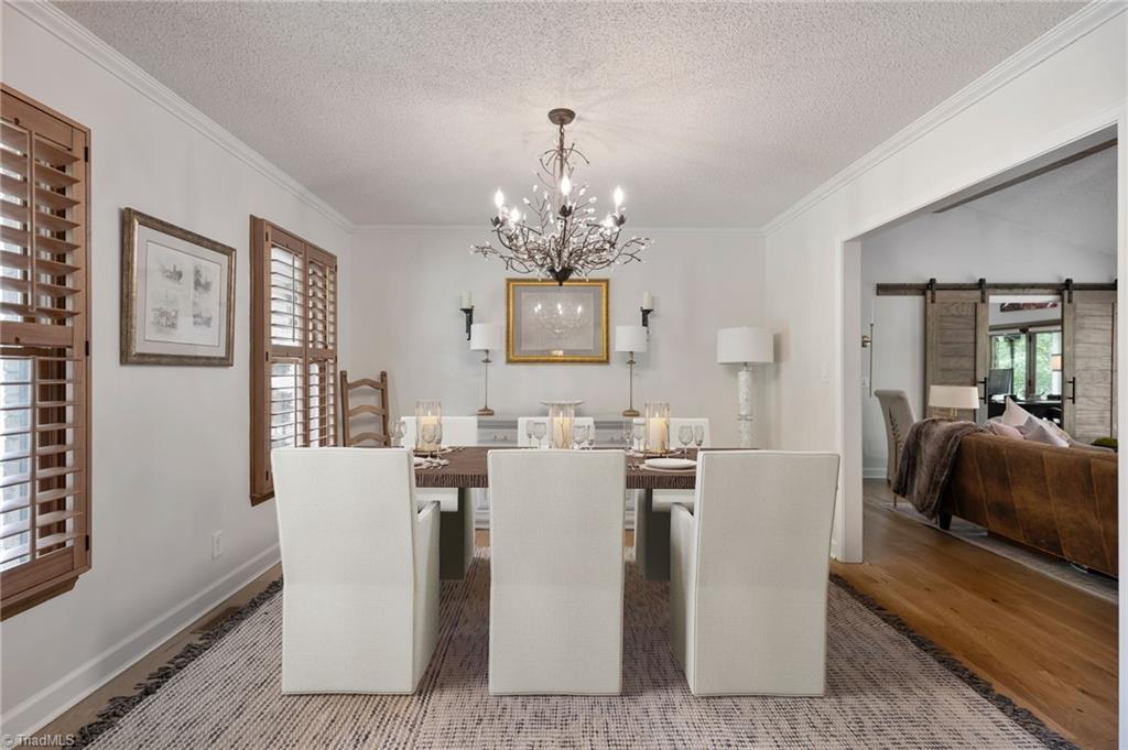 5009 Millstaff Drive Oak Ridge, NC 27310 - Photo 26 of 50 Picture is virtually staged with table.
