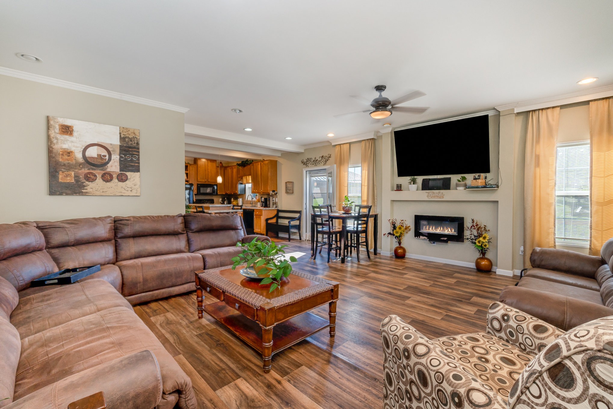 6175 Crawford Store Road Springfield, TN 37172 - Photo 6 of 19 a living room with furniture a flat screen tv and a fireplace
