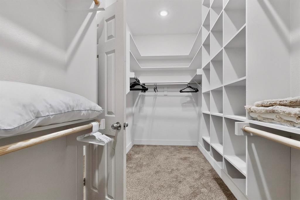 2015 Volga Avenue Dallas, TX 75216 - Photo 19 of 38 Walk in closet featuring light carpet